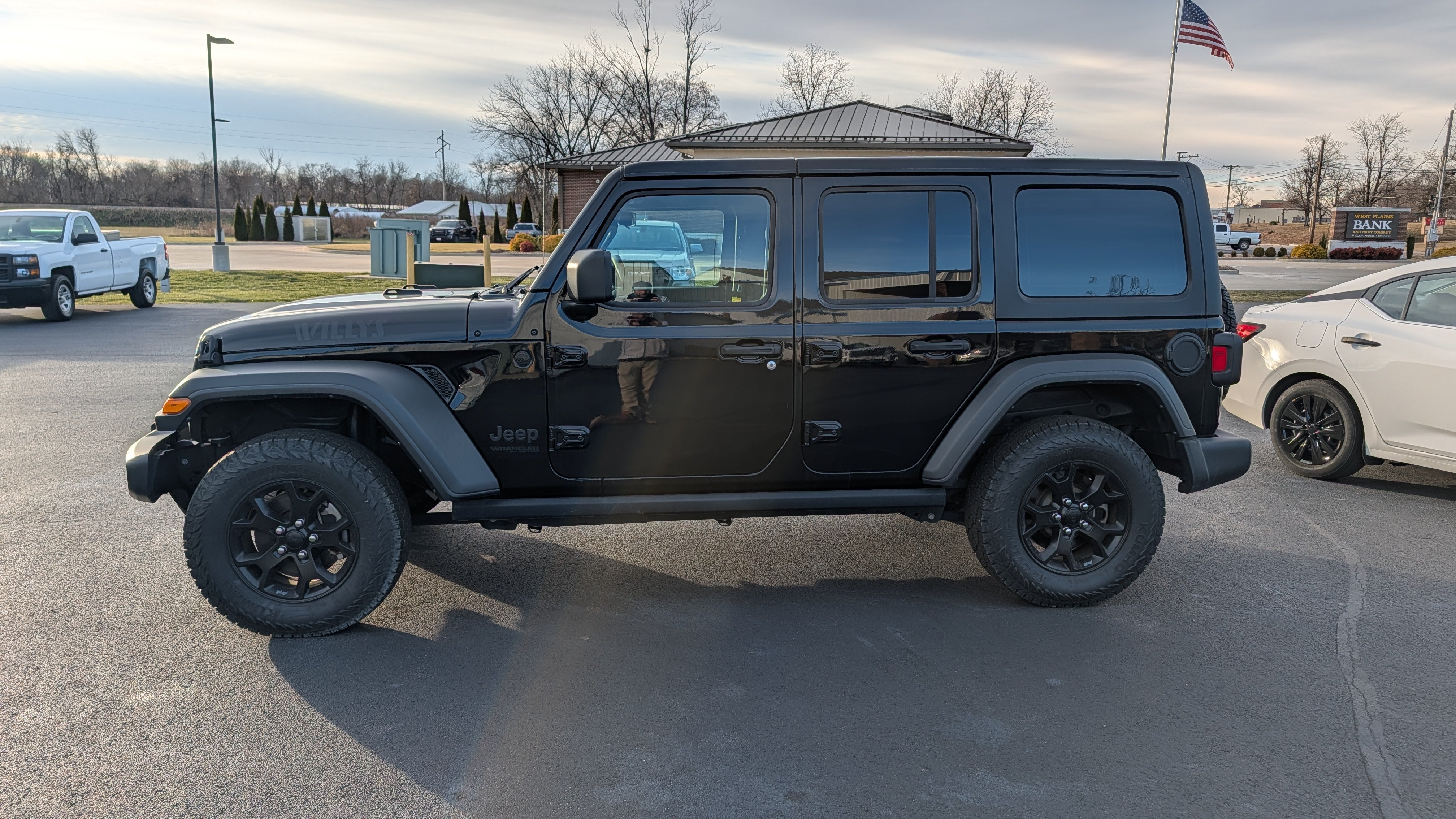 2021 Jeep Wrangler Unlimited Willys Sport in Black — front three-quarter view
