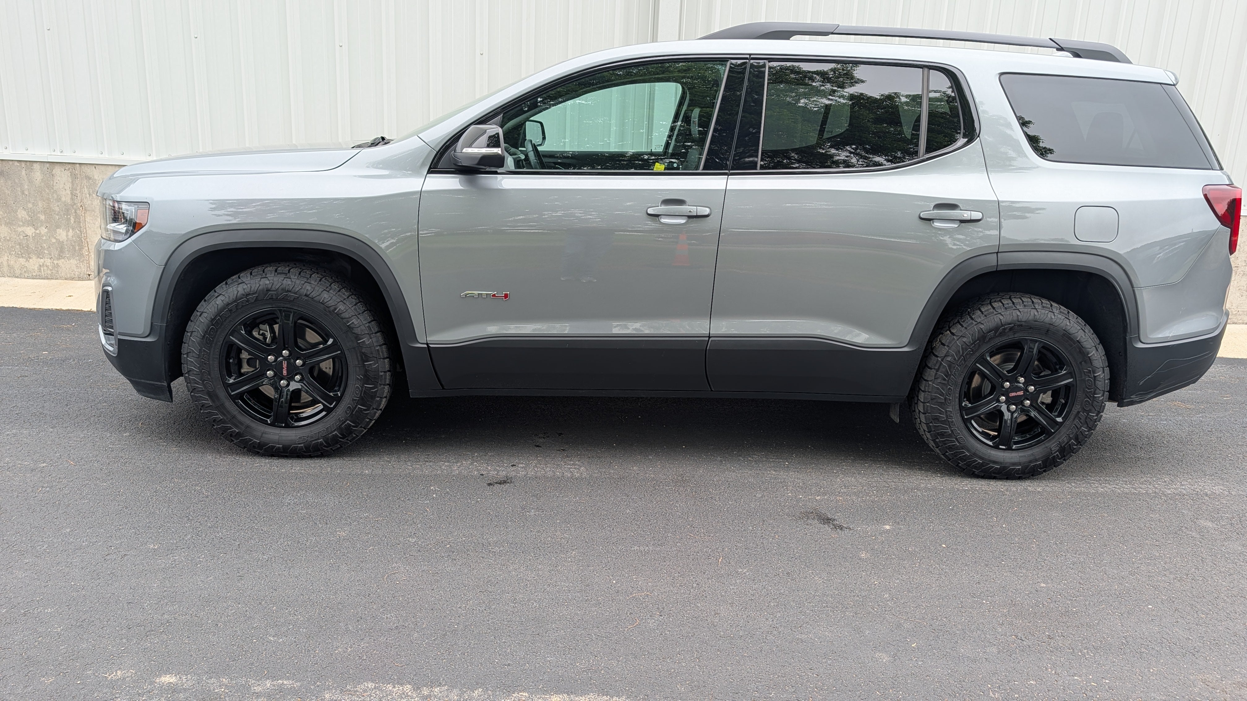 2023 GMC Acadia AT4 in Sterling Metallic — front three-quarter view