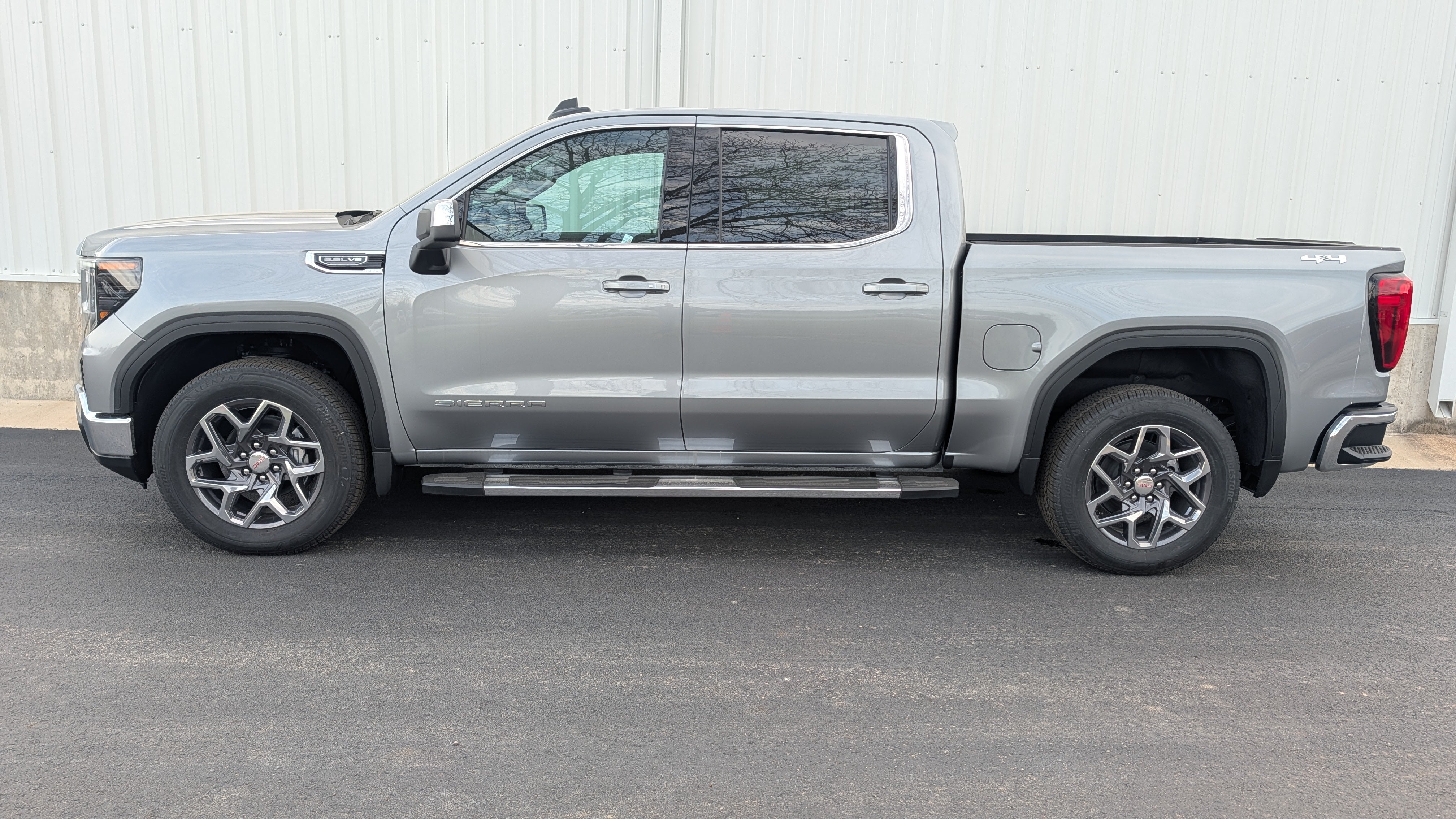 2026 GMC Sierra 1500 SLE in Sterling Metallic — front three-quarter view