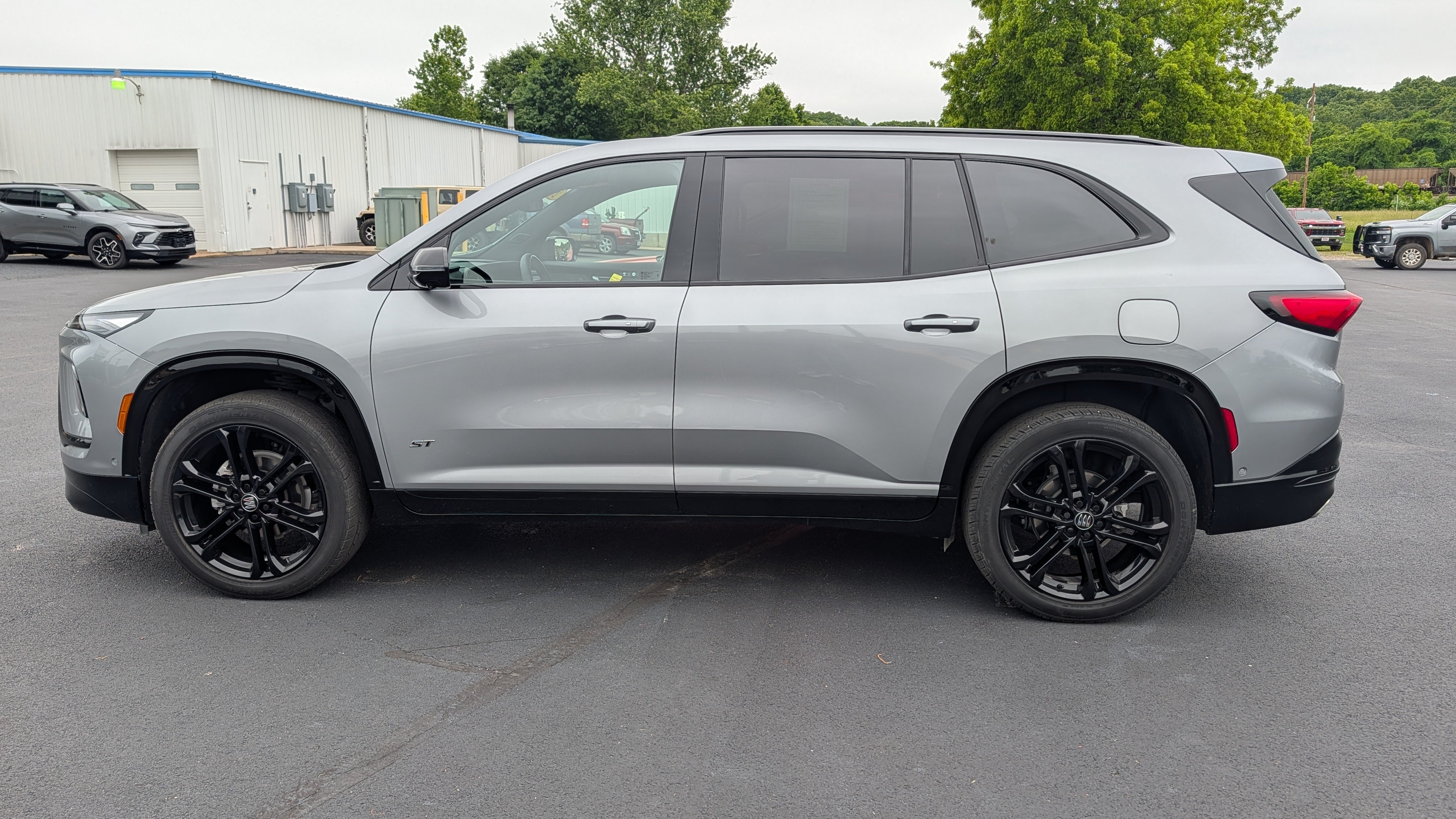 2025 Buick Enclave Sport Touring in Moonstone Gray Metallic — front three-quarter view